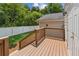 Back deck overlooking the yard and lush green landscape with privacy fence at 1480 Bettis Tribble Gap Rd, Cumming, GA 30040