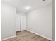 Bedroom with wood-look flooring, fresh paint and double door closet at 1480 Bettis Tribble Gap Rd, Cumming, GA 30040