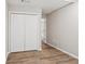 Bedroom with wood-look floors, double door closet, and fresh paint at 1480 Bettis Tribble Gap Rd, Cumming, GA 30040