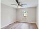 Cozy bedroom featuring a ceiling fan, and a bright window with outdoor views at 1480 Bettis Tribble Gap Rd, Cumming, GA 30040