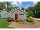View of a charming home entrance with landscaping and beautiful trees in the background at 1480 Bettis Tribble Gap Rd, Cumming, GA 30040