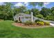 Lovely home with a green lawn, a chimney, and healthy shrubbery at 1480 Bettis Tribble Gap Rd, Cumming, GA 30040
