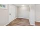 Bright foyer with attractive wood-look flooring and a freshly painted front door at 1480 Bettis Tribble Gap Rd, Cumming, GA 30040
