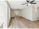 Spacious living room with modern ceiling fans, neutral paint, and durable wood-look flooring at 1480 Bettis Tribble Gap Rd, Cumming, GA 30040
