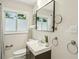 Well-lit bathroom features a modern vanity, stylish mirror, and neutral tones creating a serene space at 1617 Columbia Cir, Decatur, GA 30032