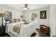 Bright bedroom with a ceiling fan, windows, and a comfortable bed at 1617 Columbia Cir, Decatur, GA 30032