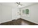 Bedroom featuring a built in cabinet, shelves, and bright window at 1617 Columbia Cir, Decatur, GA 30032