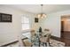 Cozy dining room with modern table, rug, and lighting at 1617 Columbia Cir, Decatur, GA 30032