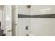 Shower with subway tile, black accent, and brushed nickel fixtures at 1617 Columbia Cir, Decatur, GA 30032