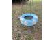 Blue tire swing with daisy painting in a shady backyard at 1617 Columbia Cir, Decatur, GA 30032