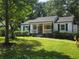 Charming single story home with a welcoming front porch and well-manicured lawn at 1617 Columbia Drive, Decatur, GA 30030