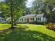 Charming single story home with a welcoming front porch and well-manicured lawn at 1617 Columbia Drive, Decatur, GA 30030