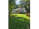 Charming single story home with a welcoming front porch and well-manicured lawn at 1617 Columbia Drive, Decatur, GA 30030