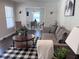 Cozy living room featuring modern decor, natural light, and an open layout to the dining area at 1617 Columbia Drive, Decatur, GA 30030