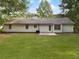 The backyard features a spacious lawn and patio at 230 Myrtle Grove Ln, Covington, GA 30014