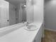 Clean bathroom features a single sink vanity with ample counter space and a large mirror at 230 Myrtle Grove Ln, Covington, GA 30014