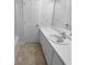 Clean bathroom features a single sink vanity with a large mirror at 230 Myrtle Grove Ln, Covington, GA 30014