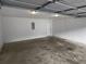 Spacious garage with lighting and ample room for parking and storage at 230 Myrtle Grove Ln, Covington, GA 30014