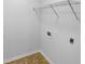 Functional laundry area with a utility shelf and outlets for appliances at 230 Myrtle Grove Ln, Covington, GA 30014