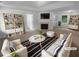 Bright living room with cozy fireplace, neutral decor, and stylish furnishings offers a comfortable living space at 230 Myrtle Grove Ln, Covington, GA 30014