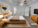 Serene main bedroom features a spacious layout with a ceiling fan and neutral tones for relaxation at 230 Myrtle Grove Ln, Covington, GA 30014