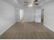 Spacious main bedroom with ceiling fan and neutral tones provides a peaceful retreat at 230 Myrtle Grove Ln, Covington, GA 30014