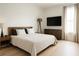 A modern bedroom with hardwood floors, a king bed, and light streaming in at 2424 Memorial Drive Se Dr # 3, Atlanta, GA 30317