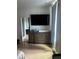 Bedroom with wooden dresser and TV, natural light and bathroom view at 2424 Memorial Drive Se Dr # 3, Atlanta, GA 30317