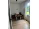 Bright dining room features modern lighting and a wooden table with seating for four at 2424 Memorial Drive Se Dr # 7, Atlanta, GA 30317