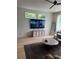 Open concept living room with modern TV, ceiling fan, and a patterned area rug at 2424 Memorial Drive Se Dr # 7, Atlanta, GA 30317