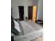 Spacious main bedroom featuring a walk-in closet, neutral decor, and natural light at 2424 Memorial Drive Se Dr # 7, Atlanta, GA 30317