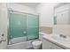 View of full bathroom with mint green tile and shower-tub combination at 4266 Roswell Ne Rd # H4, Atlanta, GA 30342