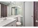 Bathroom with floral shower curtain, mirror and standard toilet at 4266 Roswell Ne Rd # H4, Atlanta, GA 30342