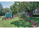 Well-maintained condominium complex entrance with mature landscaping and signage for The Cove Condominium Homes at 4266 Roswell Ne Rd # H4, Atlanta, GA 30342