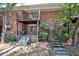 Exterior view of building with private patios and staircase to second floor at 4266 Roswell Ne Rd # H4, Atlanta, GA 30342