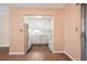 Compact kitchen with white appliances, cabinets, and countertop, seamlessly connected to the dining area at 4266 Roswell Ne Rd # H4, Atlanta, GA 30342