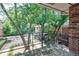 Private patio overlooking trees and other neighborhood buildings at 4266 Roswell Ne Rd # H4, Atlanta, GA 30342