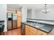 Kitchen features stainless steel fridge and appliances, neutral colors and dual sink at 786 Brookside Parc Ln, Avondale Estates, GA 30002