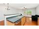 Open-concept kitchen with stainless steel sink, neutral color palette, and modern lighting at 786 Brookside Parc Ln, Avondale Estates, GA 30002