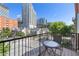 Outdoor balcony features a city view, table and chairs for outdoor relaxation at 1029 Piedmont Ne Ave # 202, Atlanta, GA 30309
