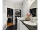 Bathroom with a stackable washer/dryer in the corner adjacent to a large vanity at 1029 Piedmont Ne Ave # 202, Atlanta, GA 30309