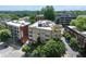 An exterior view of the residential building featuring a rooftop terrace and city views at 1029 Piedmont Ne Ave # 202, Atlanta, GA 30309