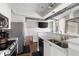 Bright kitchen featuring granite countertops, stainless steel appliances and an opening to the open-concept living area at 1029 Piedmont Ne Ave # 202, Atlanta, GA 30309