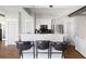 Contemporary kitchen with marble counters, stainless steel appliances, and breakfast bar seating for three at 1029 Piedmont Ne Ave # 202, Atlanta, GA 30309
