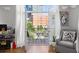 Cozy living area with balcony access, comfortable seating and stylish decor at 1029 Piedmont Ne Ave # 202, Atlanta, GA 30309
