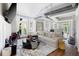 Bright, open living room with hardwood floors and exposed ductwork, filled with natural light from the french doors at 1029 Piedmont Ne Ave # 202, Atlanta, GA 30309