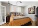 Cozy bedroom with hardwood flooring, natural lighting, and stylish decor at 1029 Piedmont Ne Ave # 202, Atlanta, GA 30309