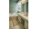 Bright bathroom featuring a soaking tub, double vanity, and decorative accents at 126 Woodbury Ln, Canton, GA 30114