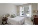 Bright bedroom with two windows, neutral color scheme, and a cozy atmosphere at 126 Woodbury Ln, Canton, GA 30114