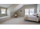 Spacious bedroom with a built-in bench, sloped ceilings, and a cozy atmosphere at 126 Woodbury Ln, Canton, GA 30114